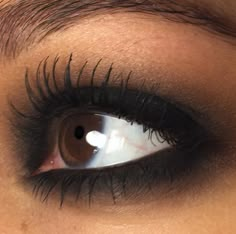 a woman's eye with long lashes