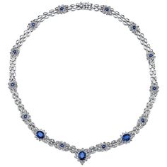 A dazzling necklace featuring 6.48 carats of vivid blue sapphires. The oval and princess cut blue sapphires form flower clusters as they are complemented by 5.86 carats of VS quality full-cut diamonds. Set in platinum. Necklace Length: 16 1/4 inches Luxury Sapphire Diamond Necklace With Diamond Cut, Luxury Sapphire And Diamond Necklace In Silver, Luxury Sapphire Color Diamond Cut Necklace, Luxury Sapphire Necklace With Diamond, Sapphire Diamond-cut Diamond Necklace, Platinum Necklace, Blue Diamond Jewelry, Ruby And Diamond Necklace, Blue Statement Necklace