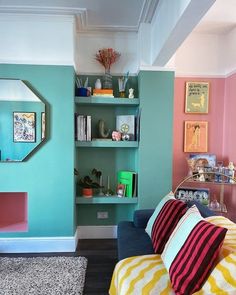 a living room filled with furniture and colorful walls