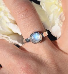 ⮚⮚ About The Design ⮘⮘ This lunar themed sterling memorial ring combines a sleek yet slightly chunky style with an 8mm Rainbow Moonstone centerpiece.  The hand-hammered 3.25mm comfort band is a nod to the moon's craters, complimented by the stone's gentle blue glow. Your beloved's ashes are held within our specially handcrafted urn setting. After the ashes are placed and your choice of stone is set, your memorial is lovingly gift-wrapped for its journey back to you.  ⮚⮚ Sending Ashes for Your Cr Unique Sterling Silver Moonstone Ring With Bezel Setting, Unique Moonstone Ring In Sterling Silver With Bezel Setting, Untreated Sterling Silver Moonstone Ring For Gift, Untreated Sterling Silver Moonstone Ring For Anniversary, Turquoise Moonstone Ring In Sterling Silver, Celestial Sterling Silver Moonstone Ring For Anniversary, Celestial Moonstone Ring In Sterling Silver For Anniversary, Untreated Moonstone Jewelry For Anniversary, Hand Forged Moonstone Ring In Sterling Silver