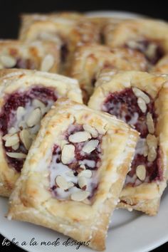 several pastries are stacked on top of each other with crumbled toppings