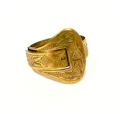 "Antique engraved wide brass buckle bracelet is truly impressive. Gorgeous mid to late 1800's Victorian cuff has intricately carved multi patterns and oversized belt buckle hinged clasp that is easy to close while staying securely fastened when wearing. A conversation piece for sure, solid and substantial high quality workmanship and design statement making piece of jewelry, I've never seen another one like it! Buckle jewelry was popularized by Queen Victoria, that carried over into the Edwardian Era and today remains a timeless symbol of romance. The buckle was a common motif in Victorian jewelry as it symbolized eternity. The idea of one end being threaded into the other, creates a never ending circle. Condition : Very good condition with normal age wear. Measurements:  3/4\"  x   7\" , Oversized Belt, Solid Gold Bangle, Buckle Jewelry, The Edwardian Era, Brass Belt Buckles, Brass Cuff, Buckle Bracelet, Wide Bracelet, Dior Jewelry