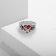 Skull Ring For Her With Heart Cut Garnet Inlaid In Two Tone-VANCARO Red Skull Ring For Anniversary, Elegant Red Skull Ring For Wedding, Elegant Red Skull Ring For Anniversary, Red Sterling Silver Heart Ring For Promise, Elegant Red Skull Ring For Gift, Gothic Rings For Valentine's Day Gift, Valentine's Day Gothic Rings As Gift, Disney Wedding Ring, Disney Wedding Rings