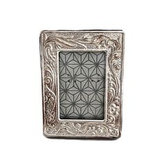 a silver frame with an intricate design on it