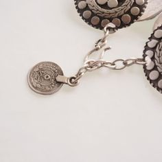 Four medallions of intricate circle designs come together to form this elegant piece. The Eternal Circles bracelet is full of exotic style and easy to wear with it's adjustable hook and chain closure. Bohemian Silver Jewelry With Adjustable Length, Elegant Adjustable Jewelry With Coin Pendant, Elegant Adjustable Coin Pendant Jewelry, Adjustable Sterling Silver Coin Pendant Jewelry, Adjustable Sterling Silver Coin Pendant, Elegant Adjustable Coin Jewelry, Elegant Adjustable Coin-shaped Jewelry, Vintage Medallion Jewelry For Festivals, Vintage Medallion Jewelry For Festival