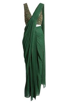 This saree has a hand-embroidered cropped top with intricate beadwork and lustrous sequins and is paired with a skirt featuring attached wraparound draping. Hidden side-zip closure V-neck Sleeveless Lined 100% viscose Spot clean Imported Asian & Pacific Islander Owned/Founded Evening Dupatta With Cutdana And Draped Style, Evening Draped Dupatta With Cutdana, Evening Draped Cutdana Dupatta, Navratri Draped Choli For Reception, Reception Draped Semi-stitched Choli, Navratri Reception Draped Choli, Silk Draped Lehenga For Designer Wear, Draped Cutdana Lehenga For Reception, Festive Draped Art Silk Dupatta