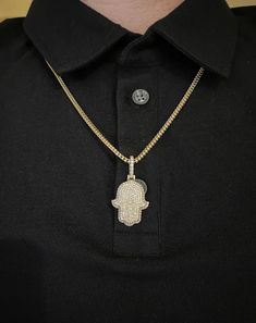 14k solid gold diamond Hamsa Pendant. Material: 14k solid Yellow Gold.Diamonds: 2.50 carats of round brilliant diamonds.Average quality used: VS2-SI1.Average diamond color used: F color.Gold weight: Approximately 9.5 grams.Length: Pendant is Approximately 1 inch long. With diamond bail 1.5 inches long. Width: 0.75 inches wide.Comes with Certificate of authentication.Comes in a nice box.Make it personal. Add a custom engraving to the back of this solid gold pendant. *Chain is sold separately. Mod Hand Set Diamond Pendant Necklaces, Vvs Clarity 14k Gold Diamond Pendant Necklace, Diamond Cuban Link Necklaces For Anniversary, Cuban Link Diamond Necklaces For Anniversaries, Cuban Link Diamond Necklaces For Anniversary, Diamond White Cuban Link Necklace As Gift, Silver Gold-plated Diamond Necklace With Round Pendant, Silver Diamond Cut Necklace Gold Plated, Gold Plated Diamond Necklace In Silver Color