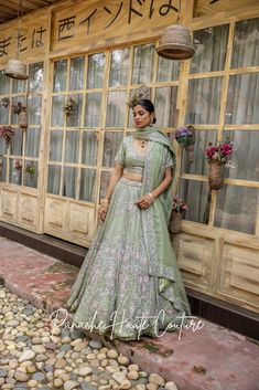 Sage Green Organza Lehenga with Silver Embroidery Embrace the elegance of the Ruhani Collection with this Sage Green Organza Lehenga from Panache Haute Couture. The lehenga features intricate silver embroidery beautifully accented with pink floral motifs, making it an ideal choice for brides seeking a blend of modern charm and traditional luxury. The lightweight organza fabric offers a graceful flow, perfect for weddings, receptions, or festive events. Designed for the fashion-forward bride, this exquisite piece is a testament to fine craftsmanship and timeless beauty. Elevate your bridal look with this stunning sage green lehenga, ideal for making a memorable statement. Brand: Panache Haute Couture Collection: Ruhani Lehenga Name: Adara Availability: Online and In-store Fabric: Full Set : Floor-length Sharara With Dupatta For Ceremony, Pista Green Raw Silk Sharara For Reception, Pista Green Sharara For Reception With Traditional Drape, Pista Green Traditional Draped Sharara For Reception, Pista Green Traditional Sharara For Reception, Raw Silk Floor-length Sharara For Wedding, Floor-length Raw Silk Sharara For Wedding, Wedding Raw Silk Floor-length Sharara, Reception Traditional Pista Green Sharara