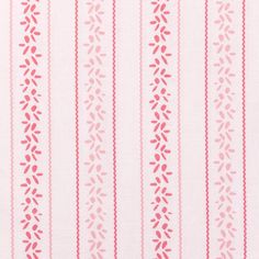 a pink and white striped fabric with small red flowers on the bottom half of it