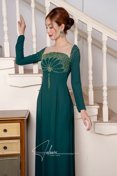 This floor length dress features a beautiful moss green fabric color, adorned with intricate beaded patterns. Its elegant design exudes sophistication and style, making it the perfect choice for any formal occasion. Elevate your wardrobe with this timeless piece. Green Ao Dai, Lace Ao Dai, Modern Ao Dai, Beaded Patterns, Lace Beading, Garment Cover, Modern Couple, Elegant Man, Floor Length Dresses