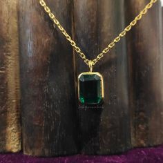 "● Free Engraving →It's a Free of Charge service, Which could be done after customer requests. \"Custom Order Always Welcome\" <> STONE DETAILS Gem Type: Cubic Zirconia High Quality Stone Stone Shape: Emerald Cut Stone Color: Green Stone Weight: 2.0 CTW (Approx.) Stone Size: 8.5*6.5 mm Indulge in the captivating beauty of our Two Stone Moissanite Pendant. This Bezel Set Solitaire Pendant features two exquisite round cut Moissanite diamonds, measuring 6mm and 4mm in diameter respectively. Set in lustrous 14k Yellow Gold, this handmade pendant exudes elegance and luxury, creating a breathtaking piece of jewelry that is sure to turn heads. The Two Stone Moissanite Pendant is a true testament to timeless beauty and craftsmanship. The bezel setting not only enhances the allure of the diamonds b Diamond Necklace Solitaire, Emerald Pendant Necklace, Emerald Necklace Pendant, Moissanite Pendant, Solitaire Setting, Diamond Solitaire Necklace, Emerald Pendant, Bezel Set Diamond, Emerald Cut Diamond