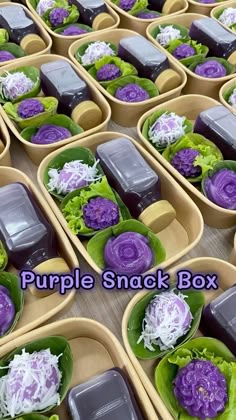 purple snack boxes filled with lettuce, cabbage and carrots for lunches