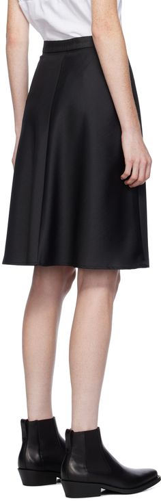 Virgin wool-blend twill skirt. Iridescent effect throughout. · High-rise · Zip-fly · Horn hardware · Unlined Supplier color: Black Workwear Satin Flared Skirt, Knee-length Silk Bottoms For Workwear, Silk Knee-length Bottoms For Work, Satin Flared Skirt For Work, Flared Satin Skirt For Workwear, Silk Skirt For Workwear In Fall, Silk Knee-length Pleated Skirt, Fall Silk Skirt For Work, Silk Workwear Skirt For Fall