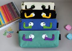 How cute are these pencil pouches for back to school? This would make the perfect back to school or new job gift. Great for both boys and girls. It could also be used as a make up bag or sewing kit.These  pencil cases make the perfect pouch for all ages! Its unique design and style caters to all personalities. Simply fill with pens, pencils, stationery or even travel essentials! This piece will arrive to you in retail packaging! Green Rectangular Pencil Case For School, Cute Stationery With Pen Holders For Back To School, Green Rectangular Stationery For Back To School, Green Rectangular Stationery For School, Cute Back To School Pen Holders Craft Supplies, Cute Pen Holders Craft Supplies For Back To School, Cute Back To School Craft Supplies With Pen Holders, Trendy Pencil Case With Pen Holders For School, Trendy Multicolor Stationery For School