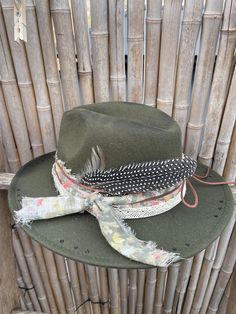 Decorated wide brimmed fedora hat will complement any outfit! With a western boho style, this hat can be for both casual and formal.  This hat has been burnt and hand stitched to give it a unique distressed appearance . Hand made hat-bands include a one of a kind design using an assortment of fabrics, premium leather and real feathers.  Please feel free to message me with any customization requests. These are quite literally completely customizable. One Size Fits MOST. 22 3/8 circumference inner Bohemian Straw Hat For Rodeo, Bohemian Fedora Straw Hat For Festivals, Bohemian Fedora Straw Hat For Country Events, Distressed Short Brim Hat For Rodeo, Western Wide Brim Fedora For Fall, Bohemian Wide Brim Straw Hat For Country Events, Country Style Distressed Hat With Flat Brim, Country Style Distressed Flat Brim Hat, Distressed Brimmed Hat For Western-themed Events