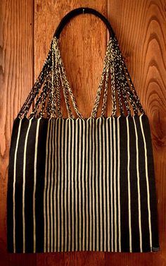 This unique handwoven market tote bag from Mexico was made on a traditional Maya loom- combining ancient weaving techniques with a modern design. It is a perfect gift, gift bag, or addition to your wardrobe. The beige and black stripes make this a bag that can be combined with many different outfits, and it looks great with a neutral outfit.  Spot clean with soap and water using cloth. Air dry only! Eco-friendly Natural Shoulder Bag With Weaving, Handwoven Black Straw Tote Bag, Black Handwoven Straw Tote Bag, Beach Shoulder Bag With Weaving, Crochet Shoulder Bag For The Beach, Handwoven Black Rectangular Beach Bag, Traditional Woven Beach Bag For Everyday Use, Artisan Woven Beach Bag For Daily Use, Traditional Woven Beach Bag