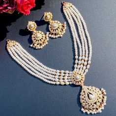 Featuring an all freshwater pearl string necklace with matching earrings in gold plated silver. A timeless and stylish look perfect for special occasions, with an understated elegance that will always be in fashion. Elegant Long Kundan Necklace For Wedding, Elegant Festive Jewelry Sets With Long Necklace, Hand Set Pearl Necklaces For Celebration, Elegant Pearl Drop Jewelry Set, Elegant Pearl Jewelry Set With Pearl Drop, Pearl Necklaces Hand Set For Celebrations, Luxury Gold Plated Pearl Necklace For Wedding, Formal Long Pearl Drop Necklace, Luxury Gold-plated Pearl Necklace For Wedding