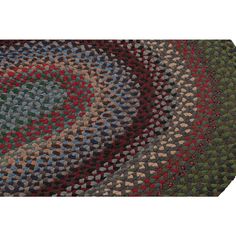 a multicolored area rug with an oval design