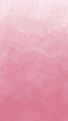 a pink and white background with watercolor stains