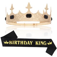 a tiara with black stones on it and the words birthday king written in gold