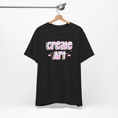 Express your passion for art with our "Create Art" graphic t-shirt. Designed to inspire artists and art teachers, this tee showcases a vibrant and eye-catching design that beautifully captures the essence of creativity. Made from premium quality materials, it offers both comfort and durability, perfect for everyday wear or as a statement piece in the art studio or classroom. Whether you're an artist seeking motivation or an art teacher looking to inspire your students, this tee is a must-have addition to your wardrobe. Makes a thoughtful gift for art lovers, creative souls, and the dedicated art educators in your life. Embrace your artistic spirit and let this tee be a symbol of your love for art and self-expression. .: 100% Airlume combed and ringspun cotton (fiber content may vary for di Artistic Cotton Art With Graphic Print, Graphic Design Cotton Art Tee, Artistic Graphic Print Art Gift, Artistic Graphic Print Art As Gift, Graphic Tee T-shirt For Artistic Expression With Custom Artwork, Graphic Tee With Graffiti Print For Artistic Expression, Graffiti Print Graphic Tee For Artistic Expression, Artistic Graphic T-shirt, Relaxed Fit T-shirt With Custom Artwork For Artistic Expression