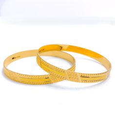 Step out in style with our Striped Machine Cut Bangles. Crafted from 22k gold with a weight of 28.5 grams, these yellow gold bangles are perfect for any occasion. With a bangle size of 2.2 and an opening diameter of 2.15", they are available in a set of 2 pieces. The intricate machine cut stripes on the surface of the bangles are sure to make a statement. PRODUCT DETAILS Gold Purity(karat): 22k Gold Weight(grams): 28.5 Item Finish: Yellow Gold Bangle Size: 2.2 Bangle Opening(diameter): 2.15" Num Elegant 22k Yellow Gold Bangle, 22k Gold Round Bangle For Formal Occasions, 22k Gold Bangle For Formal Occasions, Formal 22k Gold Round Bangle, 22k Gold Bangle For Anniversary, 22k Gold Anniversary Bangle, Formal 22k Gold Hallmarked Bangle, 22k Yellow Gold Bangle For Formal Occasions, Elegant Yellow Gold 22k Bangle