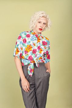 "Darling floral top with short sleeves, slouchy shape, small pointy collar, buttons from the neck down, one breast pocket and soft cotton fabric. ➽ brand: Take Away ➽ material: cotton rayon blend ➽ condition: great! ➽ model stats: 34\" 25\" 35\" 5'10 ➽ size: medium ➽ measures: waist 39\" / pit to pit 40\" / bust 40\" / length 26 1/2\" ➽ Apple Branches Vintage applebranchesvintage.etsy.com instagram.com/applebranchesvtg" Short Sleeve Tops With Button Closure For Spring, Spring Short Sleeve Tops With Button Closure, Multicolor Collared Top For Spring, Printed Collared Tops For Spring, Spring Collared Printed Tops, Printed Short Sleeve Blouse For Work, Floral Print Shirt For Spring Daywear, Short Sleeve Tops For Spring Daywear, Spring Floral Print Shirt For Daywear