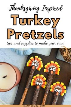 thanksgiving inspired turkey pretzels on a cutting board with candles and other holiday decorations