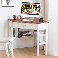 a desk with a computer on top of it