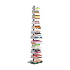 a tall stack of books sitting next to each other on top of a white floor