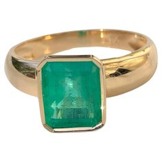 A stunning Natural Colombian Emerald with a nice brilliance, makes it a true classic emerald solitaire ring Primary Stone: 100% Natural Colombian Emerald Shape or Cut: Emerald Cut Emerald Weight: 2.68 Carats (1 emerald) Measurements Emerald: 10.20mm x 8.10mm Average Color: Medium Green Average Clarity: VS Size: 7.25 Total Gemstone Weight: 2.68 carats Setting: Classic Bezel Setting Composition: Yellow Gold 18K Total Ring Weight: 5g Comments: Classic Solitaire Condition: New Luxury Yellow Gold Emerald Ring With Round Band, Classic Yellow Gold Gia Certified Ruby Ring, Classic Yellow Gold Ruby Ring Gia Certified, Gia Certified Timeless Octagon Emerald Ring, Classic Octagon Brilliant Cut Emerald Ring, Luxury Yellow Gold Emerald Solitaire Ring, Luxury Emerald Cut Sapphire Solitaire Ring, Luxury Solitaire Emerald Ring In Yellow Gold, Luxury Solitaire Emerald Ring For Formal Occasions