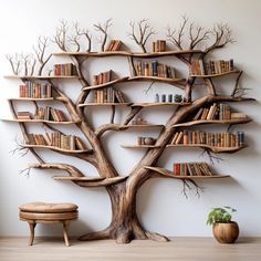 a tree with bookshelves on it is in front of a wall mounted bookcase