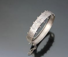 "Antique - Victorian Aesthetic hinged bangle bracelet. Late 19th century, Germany. MADE OF: silver 800. CONDITION: As seen, excellent antique condition. With no loses or dents. Clasp works well. MEASUREMENTS: Inner circumference approx. 6 3/4\" (17,2cm). Wide: 5/8\" or 15mm. Weight: 16,1g. * * * All our items are packed in gift boxes, easy to check of content and re-pack. If you wish something special, please let us know. * * * LAYAWAYS: All items can be put on layaway, max 4 months. First payme Antique Round Cuff Bracelet For Wedding, Victorian Bangle Bracelets For Wedding, Victorian Bangle Bracelet For Wedding, Antique Hallmarked Bangle For Weddings, Antique Etched Bracelets For Wedding, Victorian Bangle With Intricate Design For Wedding, Victorian Style Engraved Wedding Bracelets, Antique Etched Bangle For Wedding, Victorian Bangle For Wedding