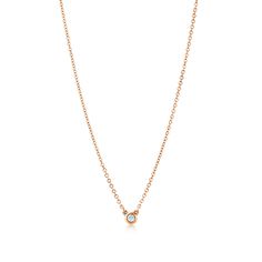 A single hand-polished diamond shines at the center of this delicate and refined 18k rose gold pendant. Elsa Peretti’s revolutionary Diamonds by the Yard® collection features a combination of fine, fluid chains and bezel-set stones that forever changed the role of diamonds in fashion. Suspended like a single drop of light against the skin, layer this design with other Diamonds by the Yard® pendants and necklaces of varying lengths and metals for a look that’s all your own. 18k rose gold with a b Middle Finger Rings, Clover Leaf Necklace, Pine Cone Necklace, Gold Necklace Long, Diamonds By The Yard, Gold Tiffany, Middle Finger Ring, Solitaire Diamond Pendant, Tiffany Diamond