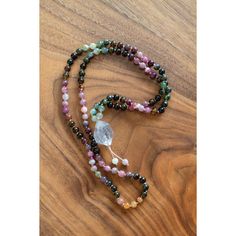 "Daring to set boundaries is about having the courage to love ourselves, even when we risk disappointing others." -Brene BrownTourmaline is a shamanic stone, providing protection during ritual work... or life in general. Multicolored Tourmaline brings the body, mind, and spirit into wholeness. This 108 bead gemstone mala can be used traditionally to give one direction. Each bead is meticulously placed for the most lovely effect. You can order this mala with or without a tassel and adjustable. The adjustable one can be worn as a necklace or as a bracelet (see photos)Stones in this mala:*6mm Tourmaline is the stone of protection and guidance.*Tibetan Quartz Crystal is the ultimate healing crystal.-Ethically sourced high-end stones, cut and polished in small, family-owned factories paying liv Mala Necklace Design, Multicolor Spiritual Gemstone Beads Crystals, Spiritual Healing Natural Stone Crystals, Holistic Healing Crystals With Natural Stones, Multicolor Spiritual Healing Crystals, Multicolor Healing Crystals, Holistic Natural Stones Crystals For Meditation, Handmade Spiritual Healing Crystals, Handmade Spiritual Crystals For Healing