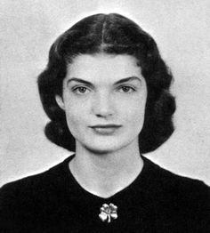 an old black and white photo of a woman