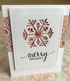 a christmas card with a snowflake on the front and merry and bright in the back