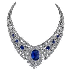 A stunning necklace featuring a 30.16 oval sapphire in the center. The sapphire is certified by GRS Lab, stating that it's a natural gemstone of Sri Lanka origin with the indication of heat. The necklace is embellished with 6 smaller oval sapphires on the sides, an oval sapphire clasp and circular and marquise diamonds. The total weight of diamonds is 100 carats. The diamonds are not certified and are equivalent to F-G-H colors, VS clarity. An appraisal is available upon request. The setting is Sapphire Diamond Necklace, Royal Crown Jewels, White Diamond Necklace, Fancy Sapphire, Diamond Tiara, Rene Lalique, Ceylon Sapphire, Heart Pendant Gold, Necklace Diamond