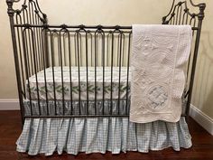 a crib with a blanket and quilt on it