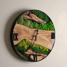 a clock made to look like a wooden road with trees and bushes on the sides