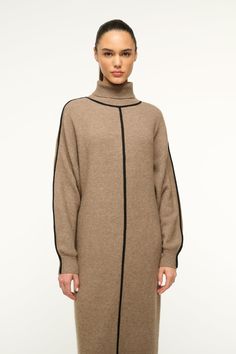 The Apres Dress is a cozy sweater dress with a turtleneck, and a contrast detail at the front, neckline, and sleeves. This style has an easy fit through the body and is a midi length. Cozy Sweater Dress, Heel Accessories, Cozy Sweater, Flat Boots, Sneaker Heels, Denim Pant, Cozy Sweaters, Sweater Skirt, Sweater Jacket