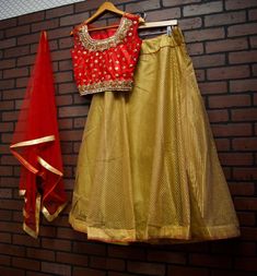 *Net Dupatta with gold border *Skirt with Full Gold Embroidery *Gold Beading on Blouse *Readymade Lehenga Choli/Crop Top Set *Size: Blouse Bust: 40 inches (+ 2 inch margin) Waist: 36 inches (+2 inch margin) Skirt length: 41 inches Skirt waist: 37 inches *Color May Vary Slightly From Picture *Our store is located in Los Angeles Festive Raw Silk Sharara With Gold Embroidery, Festive Sharara With Gold Embroidery In Raw Silk, Festive Sharara With Gold Embroidery In Chinon, Traditional Floor-length Choli For Celebrations, Festive Chinon Sharara With Gold Embroidery, Gold Raw Silk Sharara For Festive Occasions, Traditional Skirt With Resham Embroidery For Reception, Festive Gold Sharara In Raw Silk, Festive Gold Raw Silk Sharara