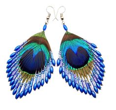 a pair of blue and green peacock feathers with beads on the end of each ear