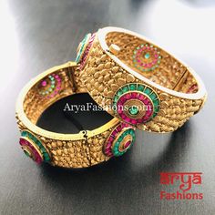 2.6,2.8 Ruby Emerald and Kundan Bangles Bracelets Features: Made in Brass with 22 Karat Gold polish Pair of 2 Bangles Thickness: Approx. 0.85 Inches Available in size 2.6,2.8 Openable Bangles Festive Jeweled Metal Bracelets, Festive Metal Jeweled Bracelets, Temple Jewelry Bangle Bracelets For Party, Adjustable Jeweled Bracelet For Festive Occasion, Metal Bangle Bracelets For Celebration, Hand Set Metal Bracelets For Celebration, Multicolor Metal Bracelets For Wedding, Festive Hand-set Metal Bracelets, Adjustable Temple Jewelry Bracelets For Party