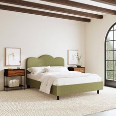 a bedroom with a bed, dressers and window in it's center area