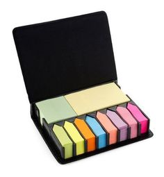 a set of colored sticky notes in a black case