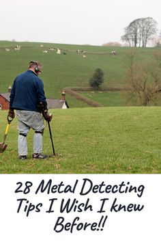 a man standing on top of a lush green field next to a metal detectorer