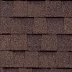 a brown roof with dark shingles