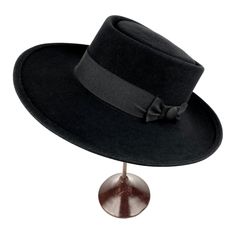 Gambler hat. Wide brim men's hat made of wool felt finished with a 40 millimeters wide gros grain ribbon. Elegant fedora for man and woman. The measurements in centimeters are 36 x 34. Brim length 9.5. Crown height 9.5 . (These measurements may vary slightly depending on the size of the hat) For its elaboration we only use hoods and capelines of resistant fur felt of very good quality. In our workshop in the Pyrenees we sew and make one by one our hats with wooden hatblocks of our own design. Fo Wool Wide Brim Boater Hat For Winter, Wide Brim Wool Boater Hat For Winter, Fitted Fedora With Flat Crown For Winter, Winter Wool Boater Hat With Wide Brim, Formal Winter Boater Hat With Flat Brim, Winter Wool Wide Brim Boater Hat, Fitted Black Boater Hat For Winter, Elegant Wide Brim Boater Hat For Winter, Western Style Boater Hat With Short Brim For Winter