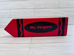 a red cardboard box with the name mrs verara on it